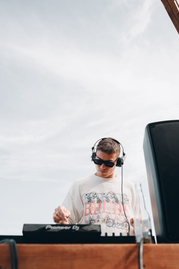 DJ wearing headphones mixing music