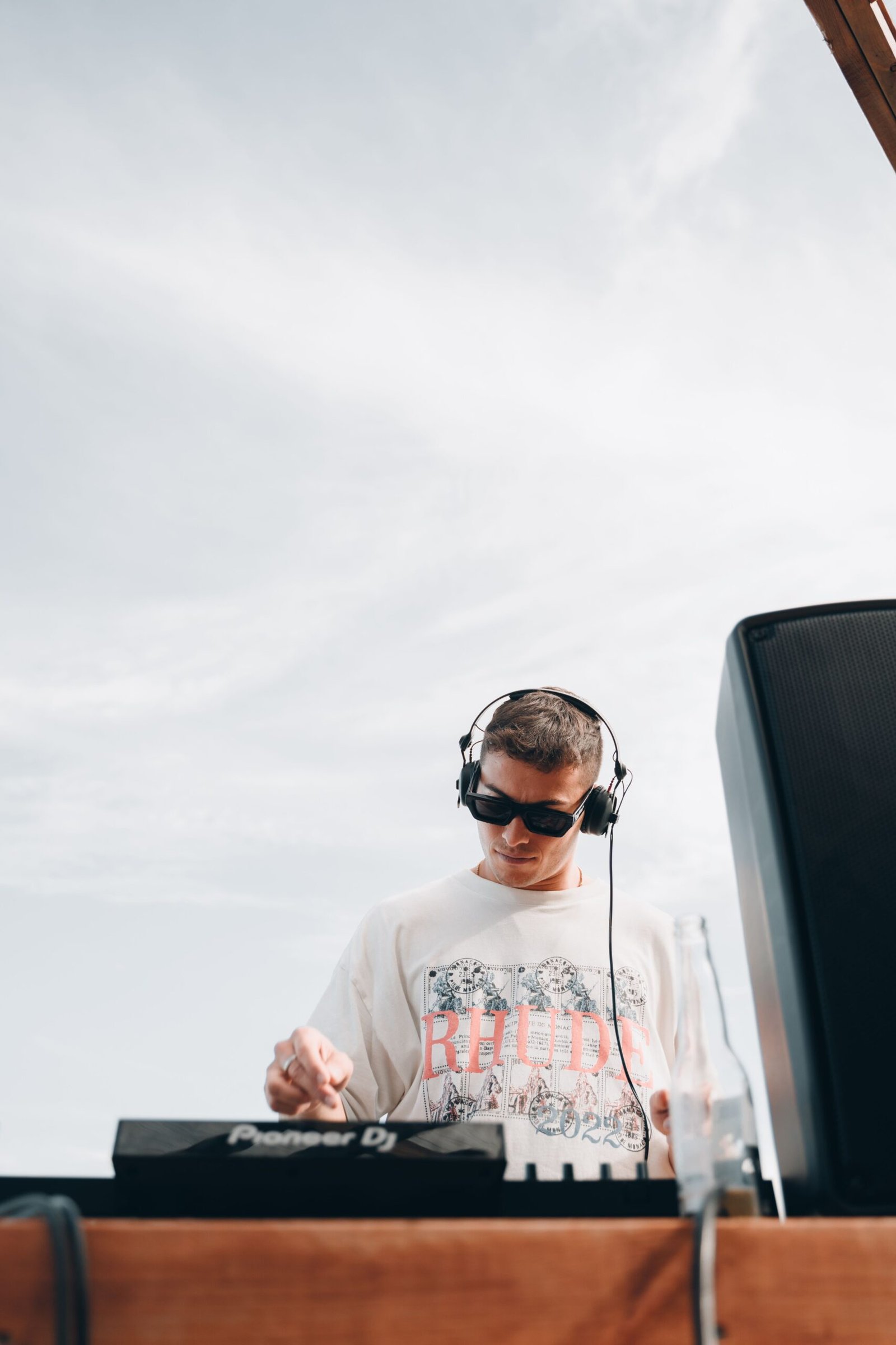 best budget dj headphones for house - DJ wearing headphones