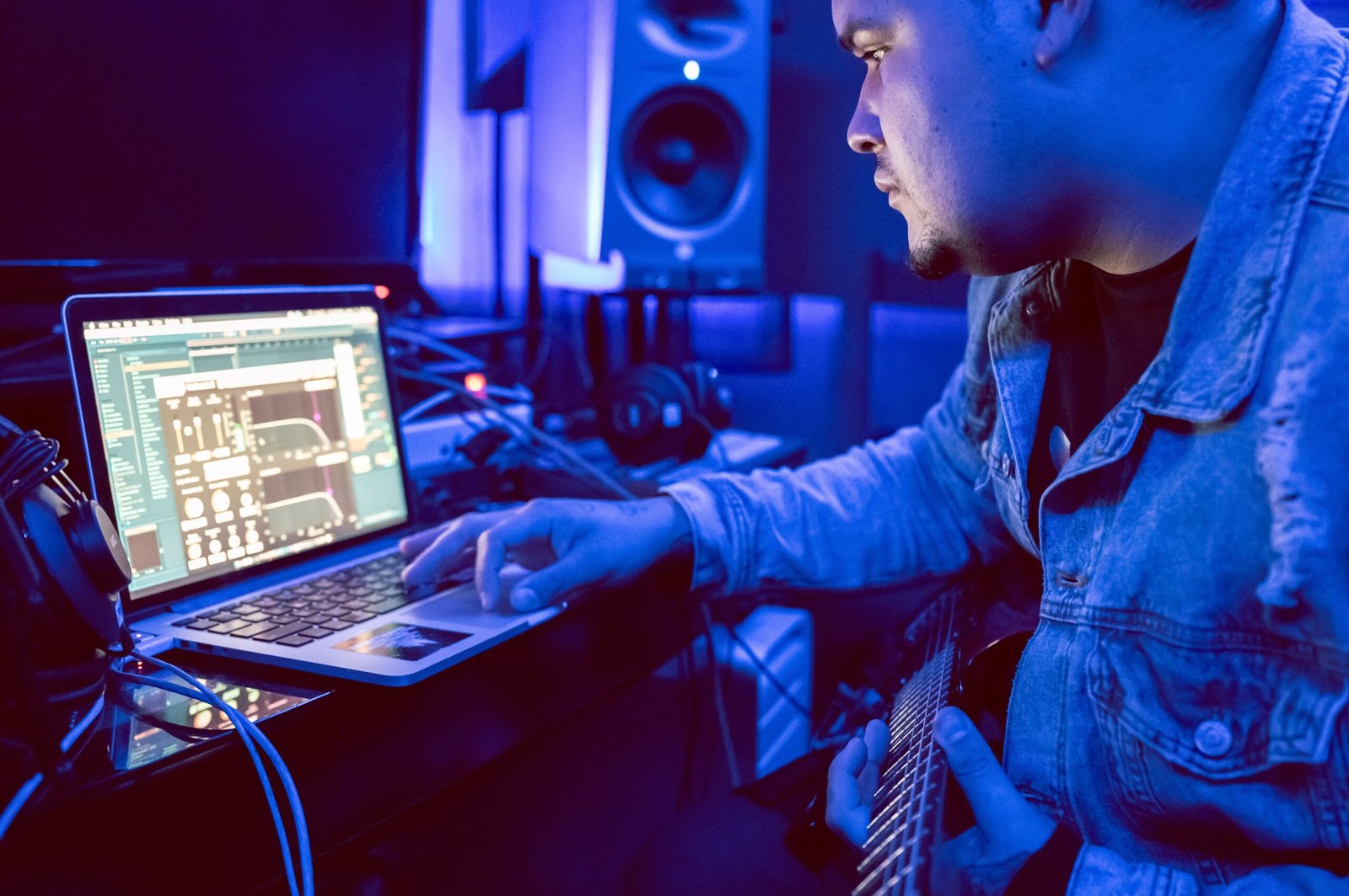 traxsource vs beatport vs bandcamp - producer working on a laptop